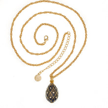 Load image into Gallery viewer, Imperial Treasures - Latticework Egg Long Necklace in Gold Plate and Translucent Night Blue Color Accented With Bohemian Crystals. Adjustable Length 30&quot; to 33&quot;.
