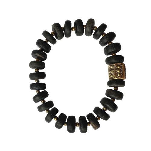 Urban Boho - Arlo Stretch bracelet is designed with organically shaped natural wood disks in Charcoal color, and accented with 24K Gold plated hexagon ornate bead | Manukyan Design Studio