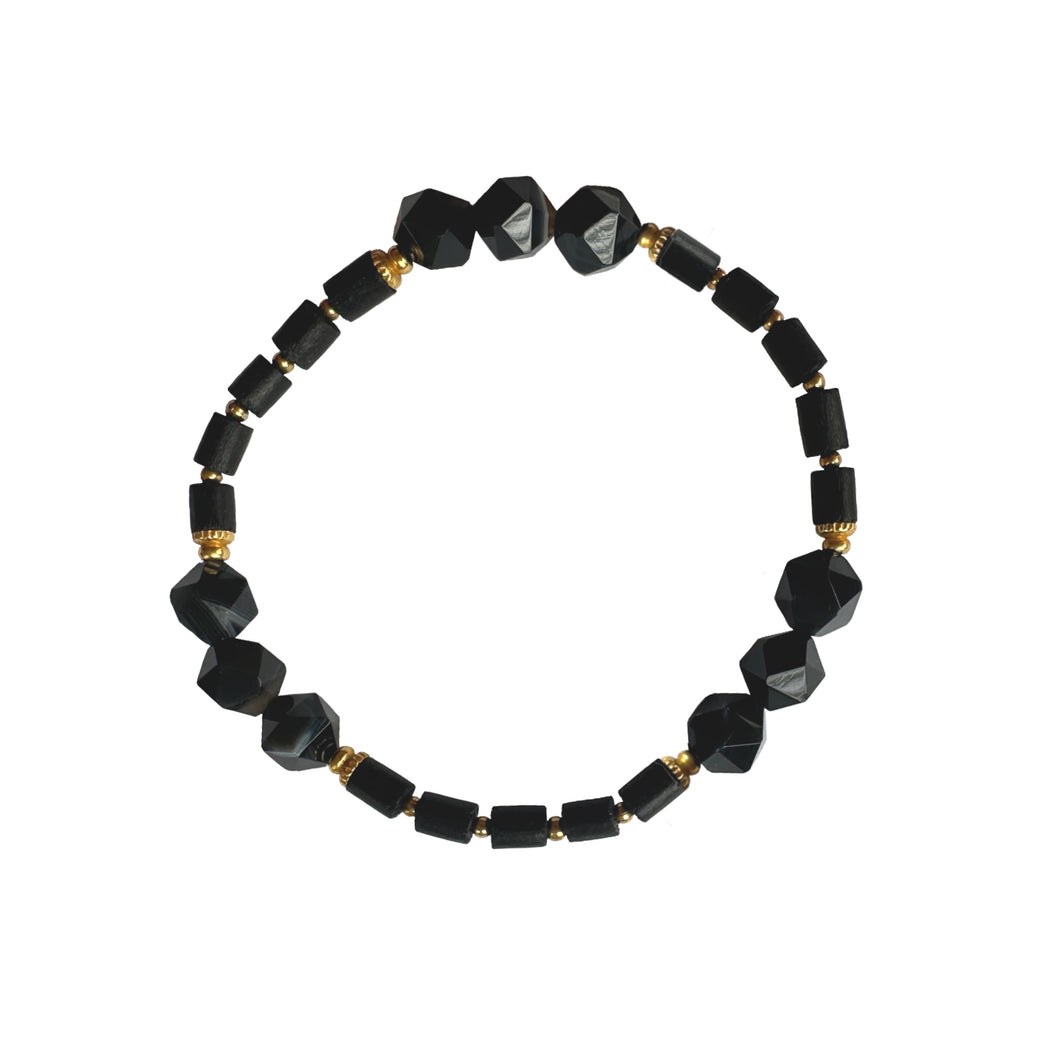 Urban Boho - Davetta Stretch Bracelet is designed with faceted Black Sardonyx and tubular beads in natural Wood in Black, accented with 24K Gold plated beads | Manukyan Design Studio