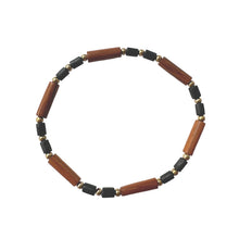 Load image into Gallery viewer, Urban Boho - Cypress Stretch Bracelet is designed with tubular shape beads of different natural Woods in Rustic Brown and Black, and accented with 24K Gold plated beads | Manukyan Design Studio
