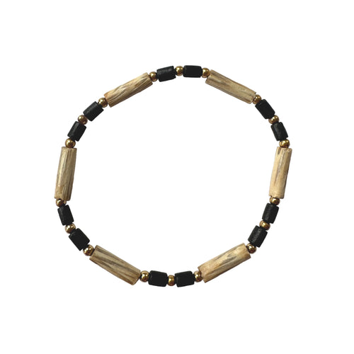 Urban Boho - Willow Stretch Bracelet is designed with tubular beads of different natural Woods in Ivory and Black, accented with 24K Gold plated beads | Manukyan Design Studio