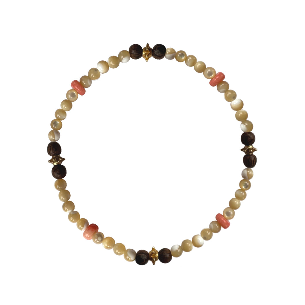 Urban Boho - Heather Stretch Bracelet is designed with Mother of Pearl beads accented with natural Pink Coral, Brown Wood and 24K Gold plated beads | Manukyan Design Studio