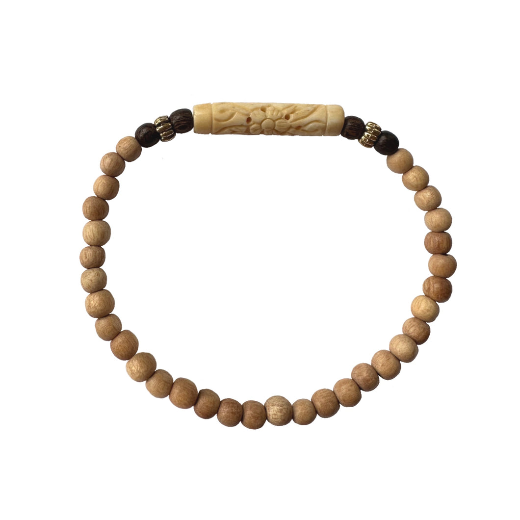 Urban Boho - Ivory Stretch Bracelet is designed with elongated tubular bead hand carved out of natural Bone and finished with natural and Brown Wood and 24K Gold plated beads | Manukyan Design Studio