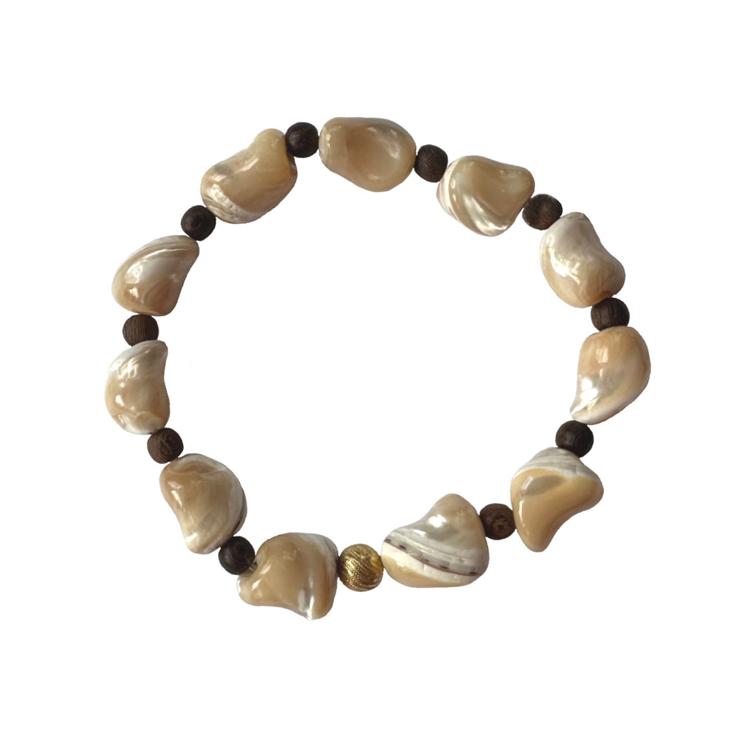 Urban Boho - Shelly Stretch Bracelet is designed with organic shape beads made of natural Freshwater Shells and accented with Brown Wood and 24K Gold plated beads | Manukyan Design Studio