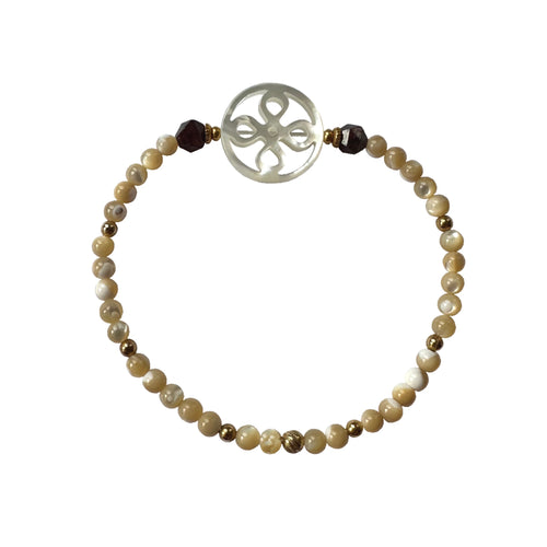 Urban Boho - Mae Stretch Bracelet is designed with large ornate and small round Mother of Pearl beads accented with faceted Garnet and 24K Gold plated beads | Manukyan Design Studio