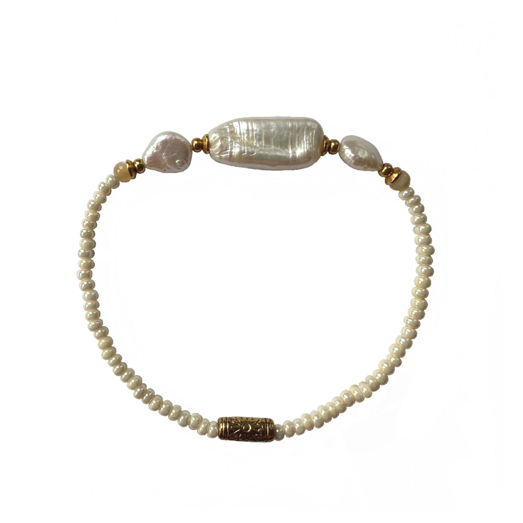 Urban Boho - Lulu Stretch Bracelet is designed with baroque shape Pearl and pearlized glass beads, accented with Mother of Pearl and 24K Gold plated beads | Manukyan Design Studio