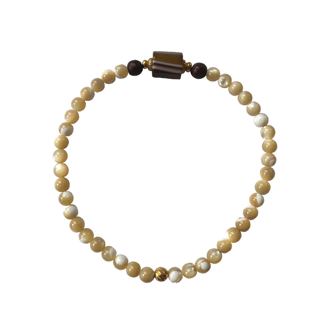 Urban Boho - Matilda Stretch Bracelet is designed with tubular shape Sardonyx and Mother of Pearl beads, accented with Brown Wood and 24K Gold plated beads | Mնւկյn Design Studio