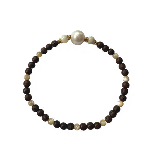 Urban Boho - Rita Stretch Bracelet is designed with a single Freshwater Baroque Pearl, natural Brown Wood and Mother of Pearl beads, accented with 24K Gold plated beads | Manukyan Design Studio