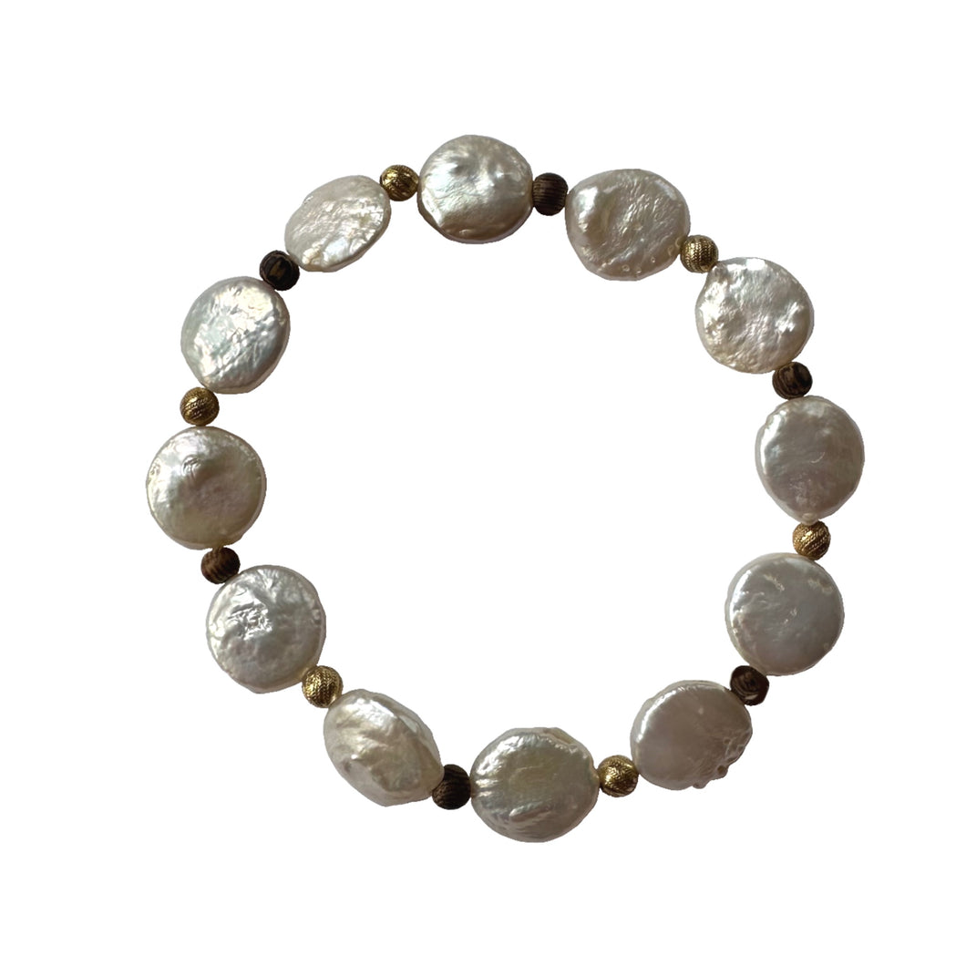 Urban Boho - Perla Stretch Bracelet is designed with Freshwater Coin Pearls accented with brown Wood and 24K Gold plated beads | Manukyan Design Studio